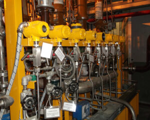 A large industrial machine with many pipes and valves.