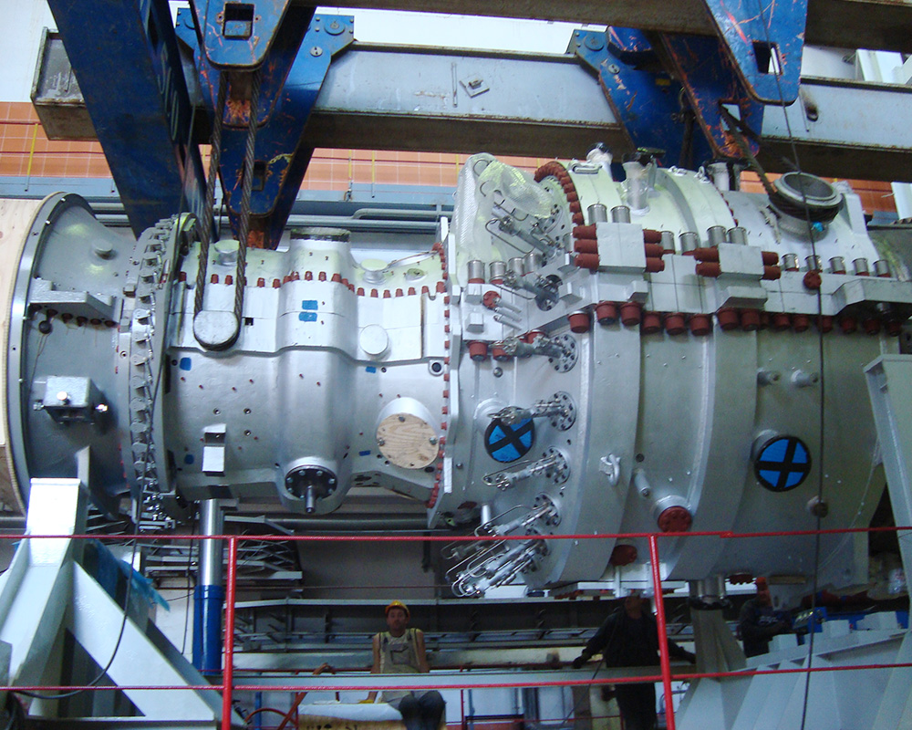 A large metal machine with blue and white markings.