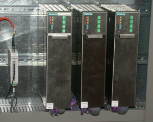 A group of three servers in a room.