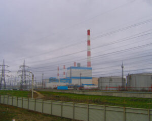 A large industrial area with power lines and buildings.