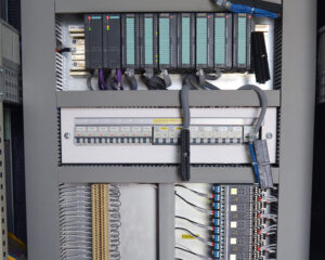 A close up of the electrical panel with wires