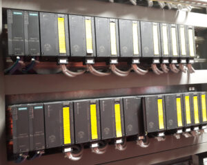 A row of computer terminals on top of each other.