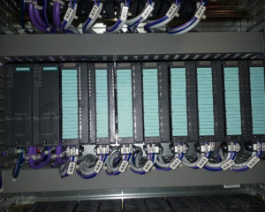 A bunch of wires are connected to the rack