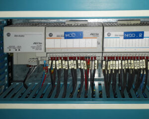 A bunch of wires that are connected to an electrical panel.